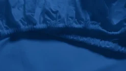 Snoozing percale katoen topper hoeslaken